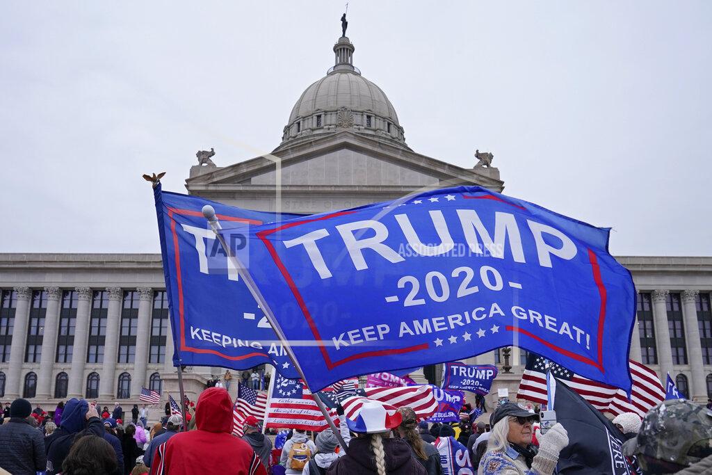 Sue Ogrocki FILE - In this Jan. 6, 2021 file photo, supporters of President Donald Trump rally at the state Capitol in Oklahoma City. Statehouses where Trump loyalists have rallied since the Nov. 3 election are heightening security after the storming of the U.S. Capitol this week. Police agencies in a number of states are monitoring threats of violence as legislatures return to session and as the nation prepares for the inauguration of President-elect Joe Biden. (AP Photo/Sue Ogrocki, File)