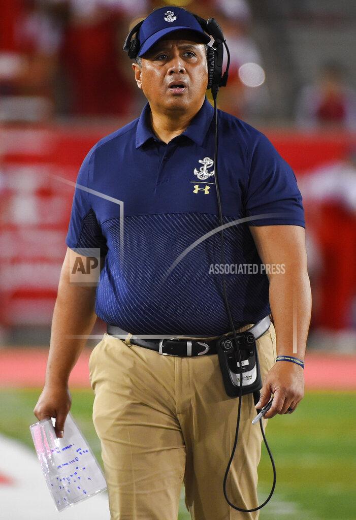 Eric Christian Smith Navy head coach Ken Niumatalolo walks the sideline during the first half of an NCAA college football game against Houston, Saturday, Nov. 30, 2019, in Houston. (AP Photo/Eric Christian Smith)