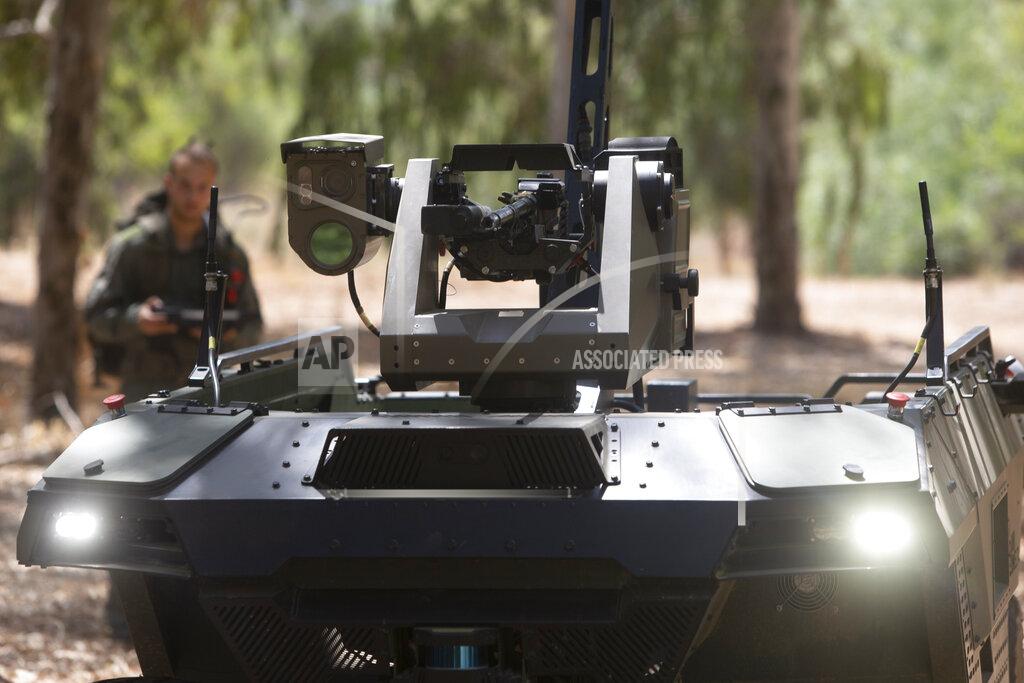 Sebastian Scheiner Israel Aerospace Industries' semi-autonomous four-wheel-drive "REX MKII" is seen at an IAI facility near the central Israeli city of Lod, Thursday, Sept. 9, 2021. Israel's state-owned Israel Aerospace Industries unveiled Monday a state-of-the-art unmanned vehicle their specialists said will be deployed alongside ground troops to assist in combat situations. (AP Photo/Sebastian Scheiner)