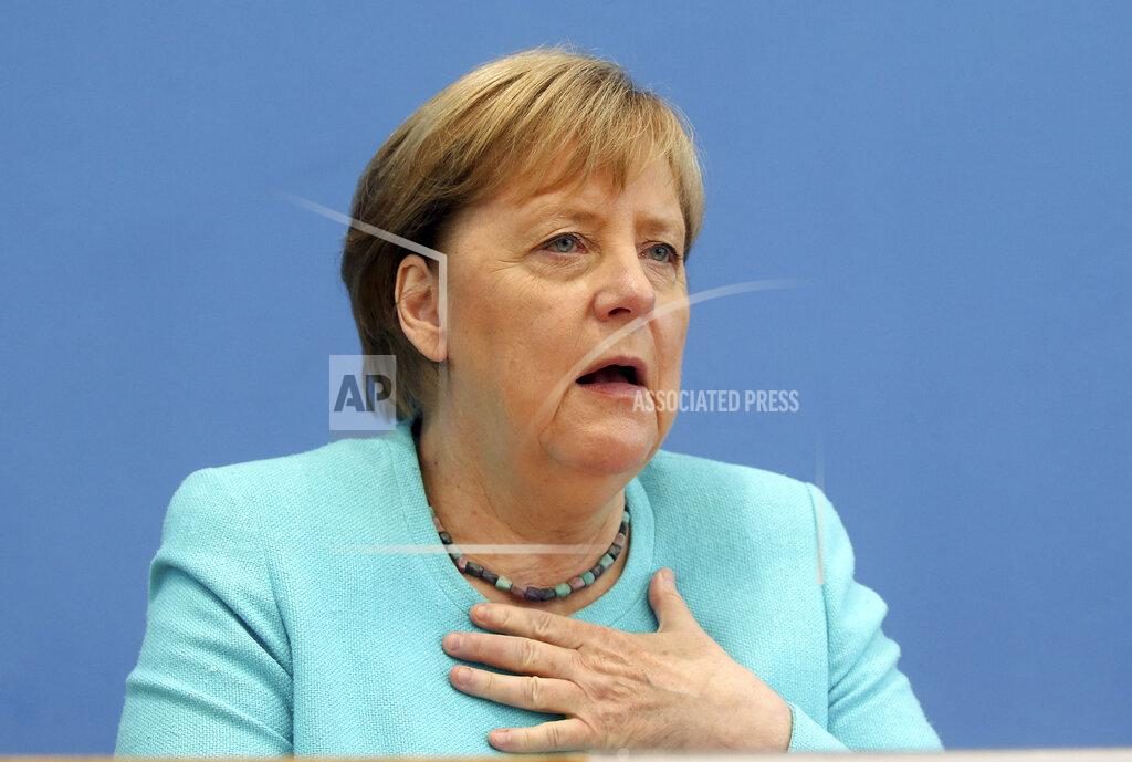 Wolfgang Kumm German Chancellor Angela Merkel, gestures, as she holds her annual summer news conference in Berlin, Germany, Thursday, July 22, 2021. Merkel said Thursday that new coronavirus infections in Germany are once again rising at worrying speed. She appealed to her compatriots to get vaccinated and persuade others to do so. (Wolfgang Kumm/dpa via AP)