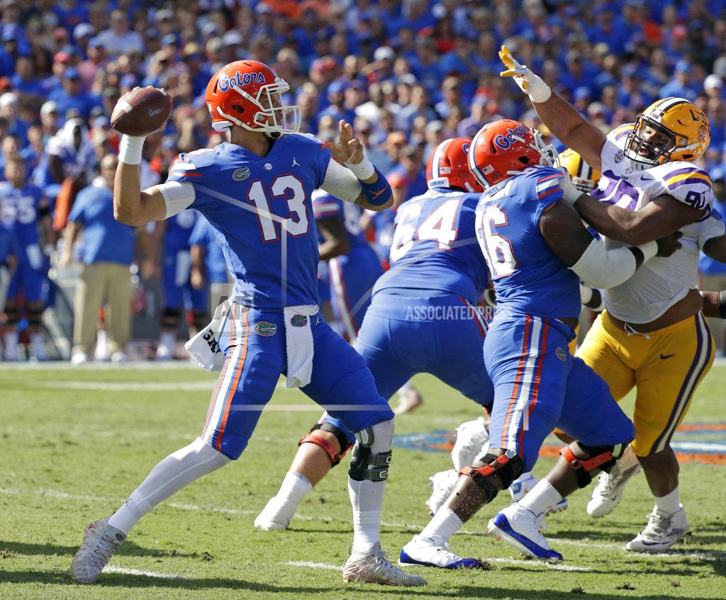 John Raoux FILE - In this Oct. 6, 2018, file photo, Florida quarterback Feleipe Franks (13) throws a pass against LSU during the first half of an NCAA college football game, in Gainesville, Fla. The Georgia Bulldogs must run a gauntlet of four straight games against Southeastern Conference opponents currently ranked in the Top 25. LSU, Florida, Kentucky and Auburn. (AP Photo/John Raoux, File)