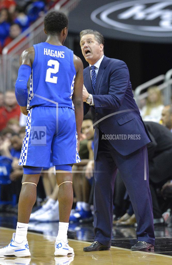 Timothy D. Easley Kentucky head coach John Calipari gives instructions to guard Ashton Hagans (2) during the second half of an NCAA college basketball game against Louisville in Louisville, Ky., Saturday, Dec. 29, 2018. Kentucky won 71-58. (AP Photo/Timothy D. Easley)