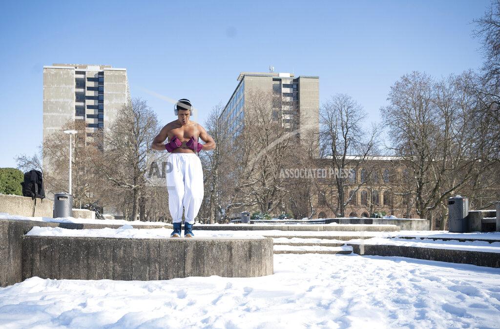 Sebastian Gollnow Bruno is practice this sport exercises in a snowy park in Stuttgart, Germany, Friday, Feb. 12, 2021. Winter weather with snow and sub-zero temperatures is still expected for Germany on the upcoming weekend. (Sebastian Gollnow//dpa via AP)