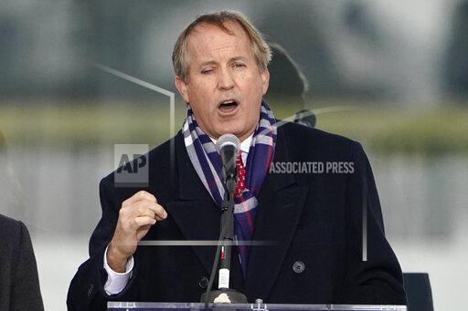 FILE - In this Jan. 6, 2021, file photo, Texas Attorney General Ken Paxton speaks in Washington. Newly unredacted documents from a state-led antitrust lawsuit against Google accuse the search giant of colluding with rival Facebook to manipulate online advertising sales. The CEOs of both companies were aware of the deal and signed off on it, the complaint alleges. The original redacted lawsuit, filed in December 2021, accused Google of “anti-competitive conduct” and teaming up with the social networking giant. (AP Photo/Jacquelyn Martin, File)