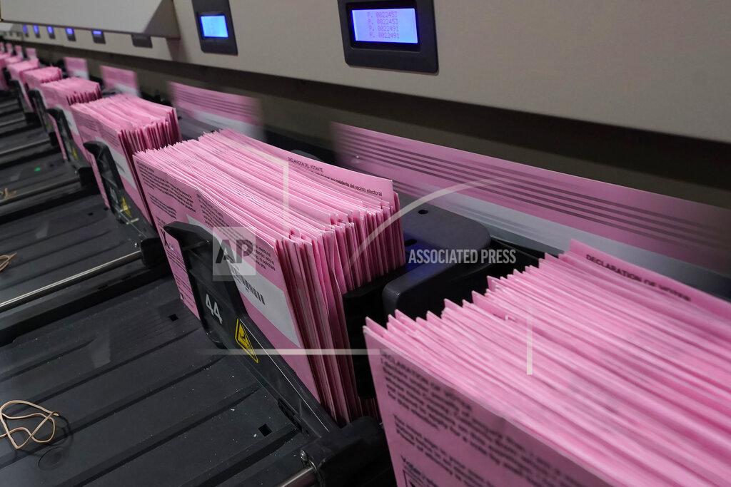 Rich Pedroncelli FILE - In this Aug. 30, 2021, file photo, mail-in ballots run through a sorting machine at the Sacramento County Registrar of Voters office in Sacramento, Calif. Every registered California voter will get a ballot mailed to them in future elections under a bill signed Monday, Sept. 27, 2021, by Democratic Gov. Gavin Newsom. The nation's most populous state mailed everyone a ballot in the two most recent elections due to concerns about voting during the pandemic. Newsom's signature makes that change permanent. Even prior to the pandemic, most Californians were receiving ballots in the mail. (AP Photo/Rich Pedroncelli, File)