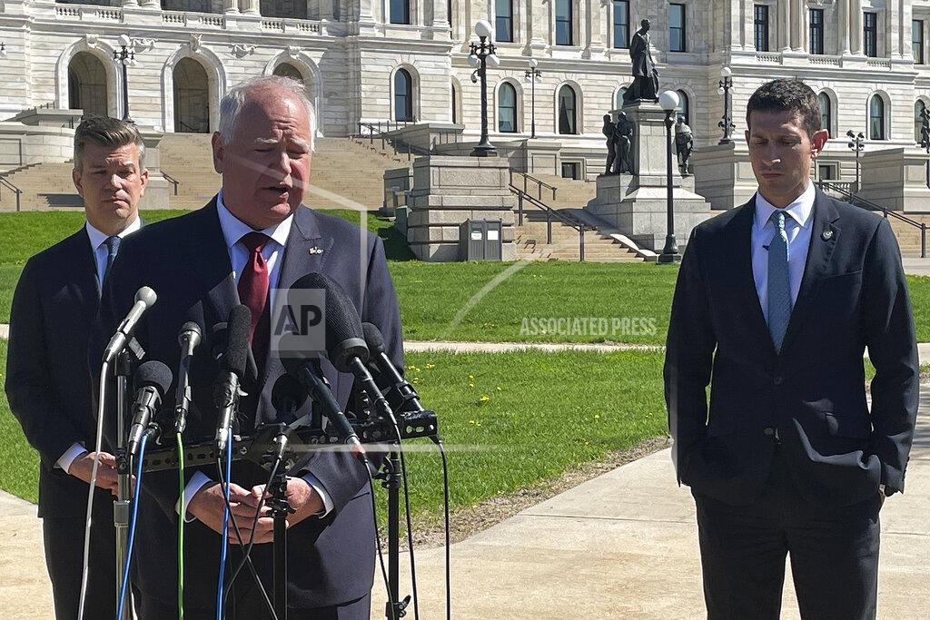Mohamed Ibrahim Democratic Gov. Tim Walz, center, talks to reporters alongside Democratic Majority Leader Ryan Winkler, of Golden Valley, left, and Republican Senate Majority Leader Jeremy Miller, of Winona, right, in front of the Minnesota State Capitol in St. Paul, Minnesota on Monday, May 16, 2022. Walz and legislative leaders announced a breakthrough bipartisan deal on a broad framework for parceling out a massive budget surplus with just a week remaining in the session. (Mohamed Ibrahim/Report for America via AP)