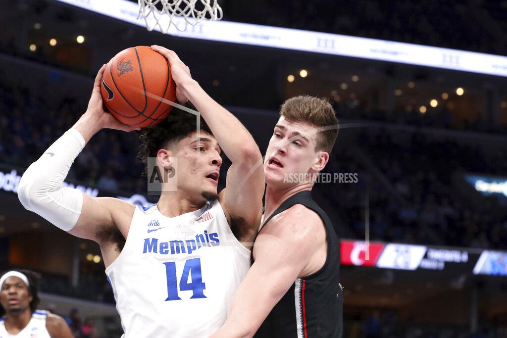 Karen Pulfer Focht Memphis' forward Isaiah Maurice (14) grabs a rebound as Cincinnati's center Chris Vogt (33) defends in the first half of an NCAA college basketball game Thursday, Jan. 16, 2020, in Memphis, Tenn. (AP Photo/Karen Pulfer Focht)