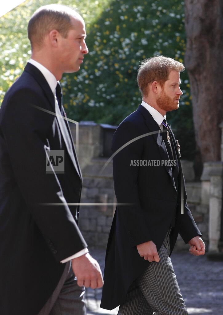 Alastair Grant Prince William, left, and Prince Harry follow the coffin in a ceremonial procession for the funeral of Britain's Prince Philip inside Windsor Castle in Windsor, England Saturday April 17, 2021. Prince Philip died April 9 at the age of 99 after 73 years of marriage to Britain's Queen Elizabeth II. (Alastair Grant/Pool via AP)