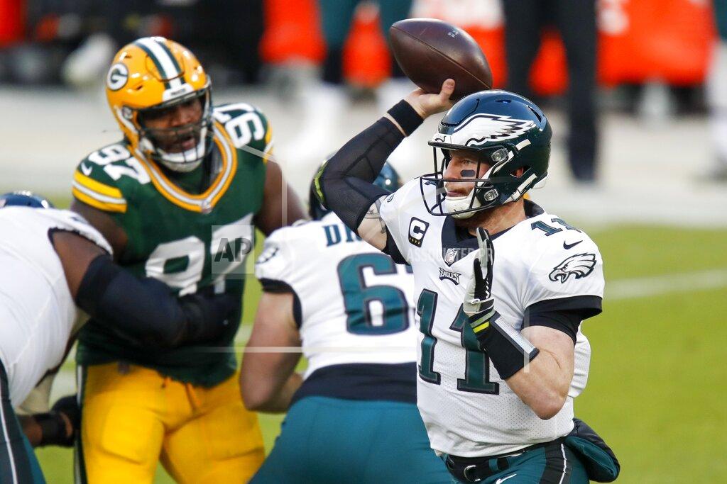 Matt Ludtke Philadelphia Eagles' Carson Wentz thorws a pass during the first half of an NFL football game against the Green Bay Packers Sunday, Dec. 6, 2020, in Green Bay, Wis. (AP Photo/Matt Ludtke)
