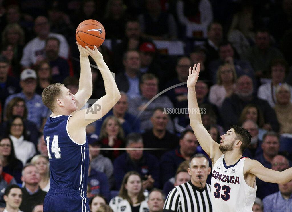 Young Kwak Loyola Marymount center Mattias Markusson (14) shoots over Gonzaga forward Killian Tillie (33) during the first half of an NCAA college basketball game in Spokane, Wash., Thursday, Jan. 17, 2019. (AP Photo/Young Kwak)