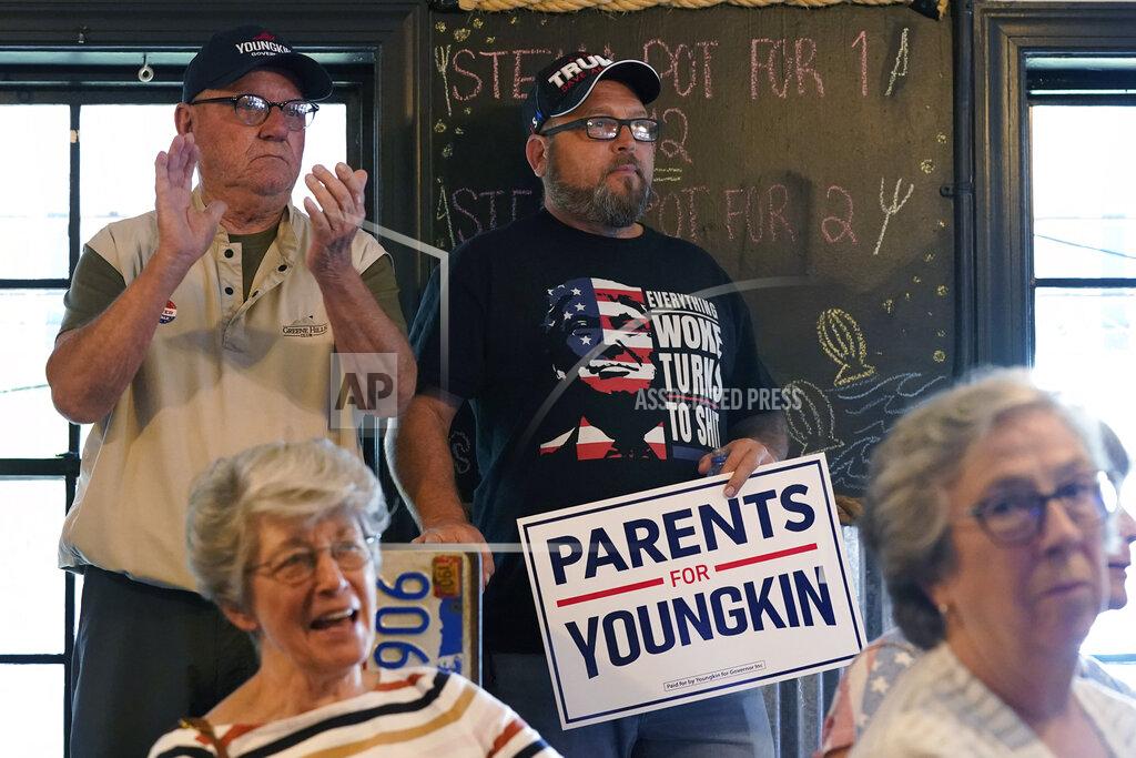 Steve Helber Supporters of Virginia Republican gubernatorial candidate Glenn Youngkin applaud their candidate during a rally in Culpeper, Va., Wednesday, Oct. 13, 2021. Youngkin faces former Gov. Terry McAuliffe in the November election. (AP Photo/Steve Helber)