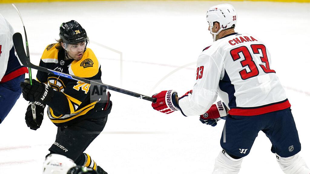 Charles Krupa Washington Capitals defenseman Zdeno Chara (33) pokes his stick at Boston Bruins left wing Jake DeBrusk (74) during the first period of an NHL hockey game, Wednesday, March 3, 2021, in Boston. (AP Photo/Charles Krupa)