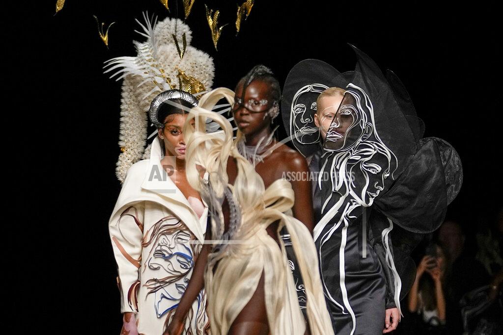 Michel Euler Winnie Harlow, from left, and models wear creations as part of Iris van Herpen Haute Couture Fall/Winter 2022-2023 fashion collection presented Monday, July 4, 2022 in Paris. (AP Photo/Michel Euler)