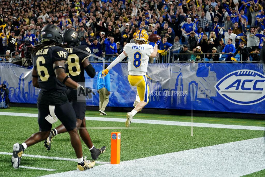 Jacob Kupferman Pittsburgh quarterback Kenny Pickett celebrates after scoring against Wake Forest during the first half of the Atlantic Coast Conference championship NCAA college football game Saturday, Dec. 4, 2021, in Charlotte, N.C. (AP Photo/Jacob Kupferman)