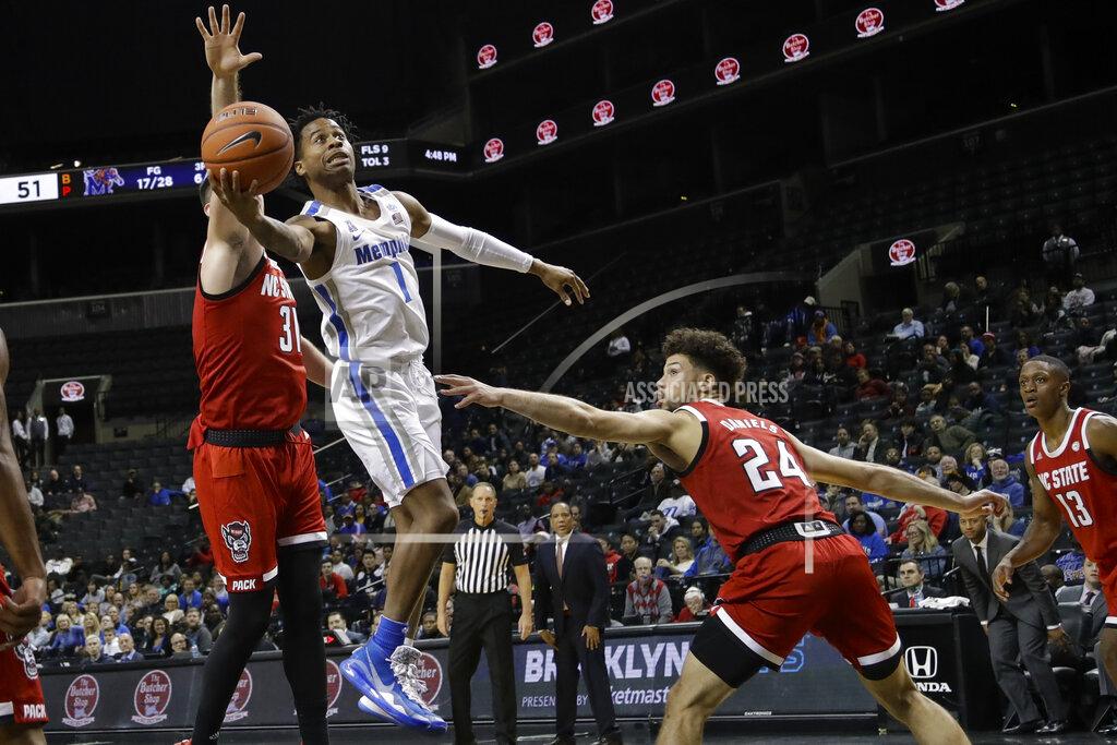 Frank Franklin Ii Memphis' Tyler Harris (1) drives past North Carolina State's Pat Andree (31) and Devon Daniels (24) during the first half of an NCAA college basketball game in the Barclays Classic Thursday, Nov. 28, 2019, in New York. (AP Photo/Frank Franklin II)