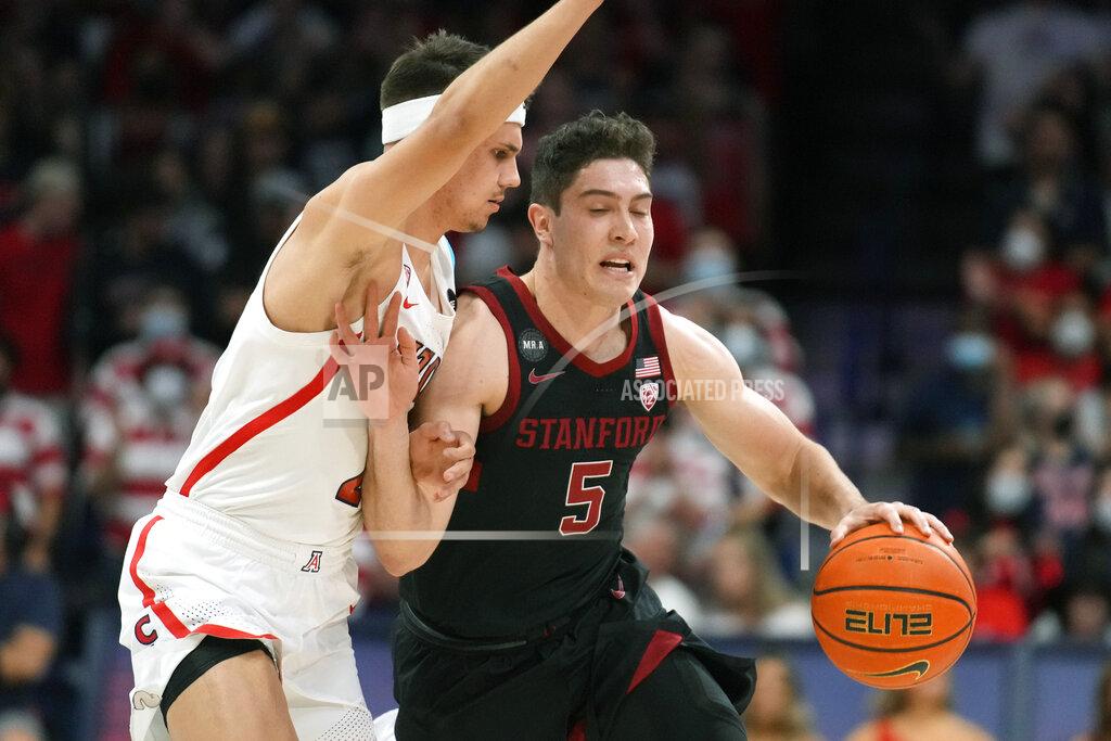 Rick Scuteri Stanford guard Michael O'Connell (5) drives on Arizona guard Kerr Kriisa during the first half of an NCAA college basketball game Thursday, March 3, 2022, in Tucson, Ariz. (AP Photo/Rick Scuteri)