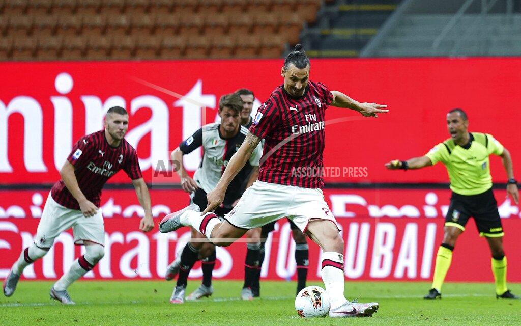 Spada AC Milan's Zlatan Ibrahimovic scores his side's opening goal on a penalty kick, during the Serie A soccer match between AC Milan and Juventus at the Milan San Siro Stadium, Italy, Tuesday, July 7, 2020. (Spada/LaPresse via AP)