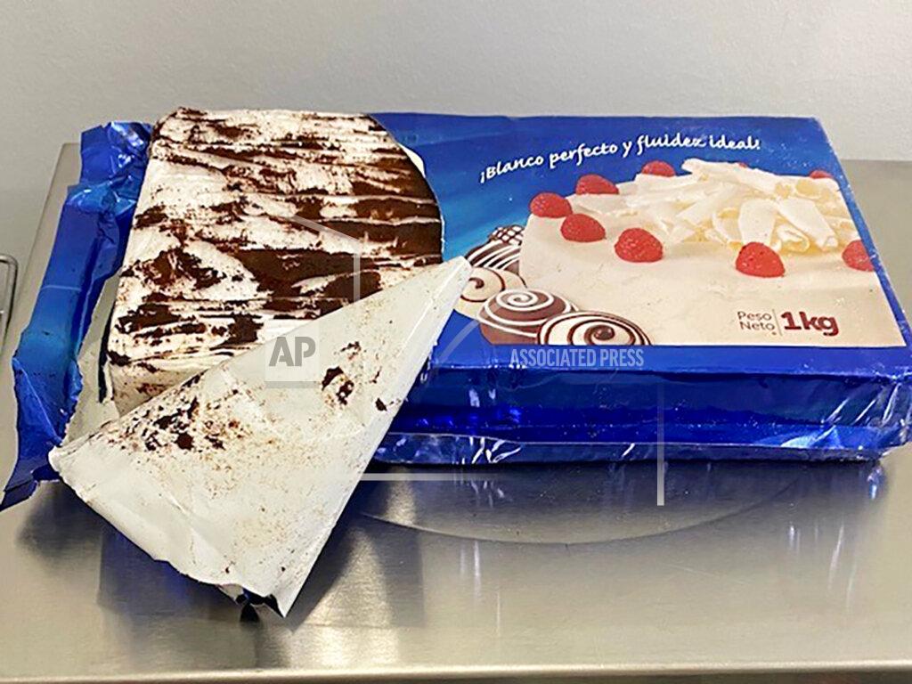 Uncredited This undated photo provided by the Maine Drug Enforcement Agency shows a marble cake containing about 2 pounds of cocaine with coffee grounds on top used to cover up the scent. A New York man and a Maine woman are facing charges, Wednesday, July 21, 2021, after the cocaine disguised as a cake was seized from their vehicle, authorities said. (Maine Drug Enforcement Agency via AP)