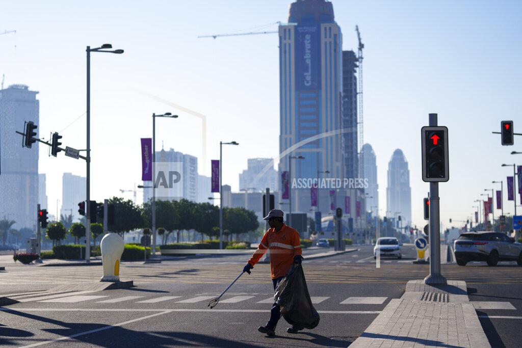 Pavel Golovkin A municipal worker walks in a street in Lusail downtown, Qatar, Thursday, Nov. 24, 2022. (AP Photo/Pavel Golovkin)