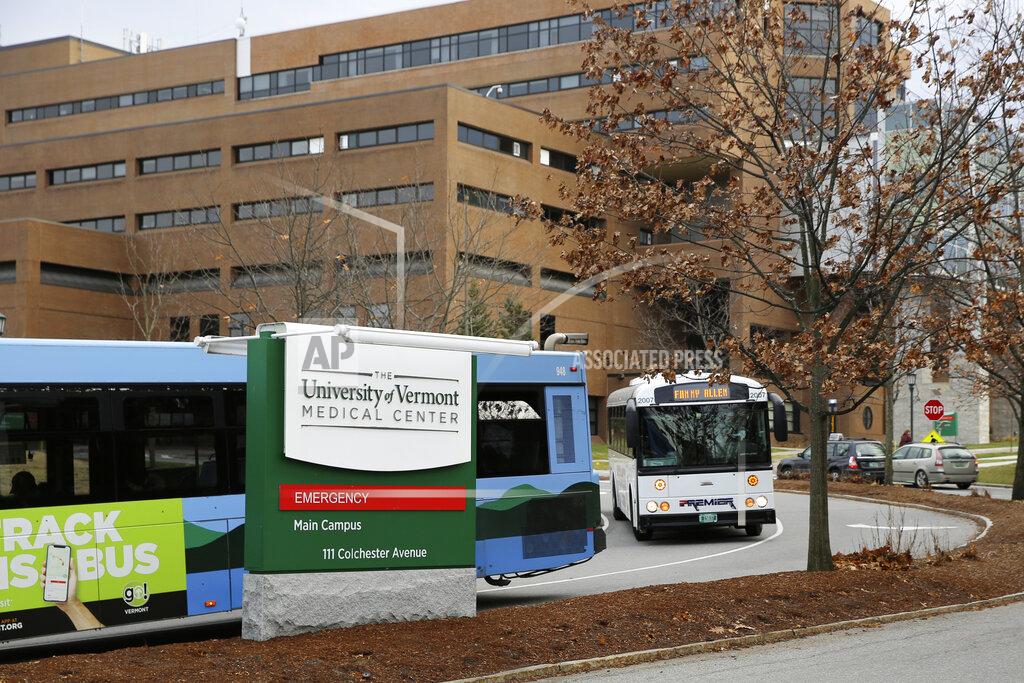 Wilson Ring Buses travel through the main campus of the University of Vermont Medical Center, Friday, Nov. 20, 2020, in Burlington, Vt. The hospital network is still recovering from a massive digital disruption in October, signaling the dangers of cyberattacks on the nation's health care system during a surge of COVID-19. (AP Photo/Wilson Ring)