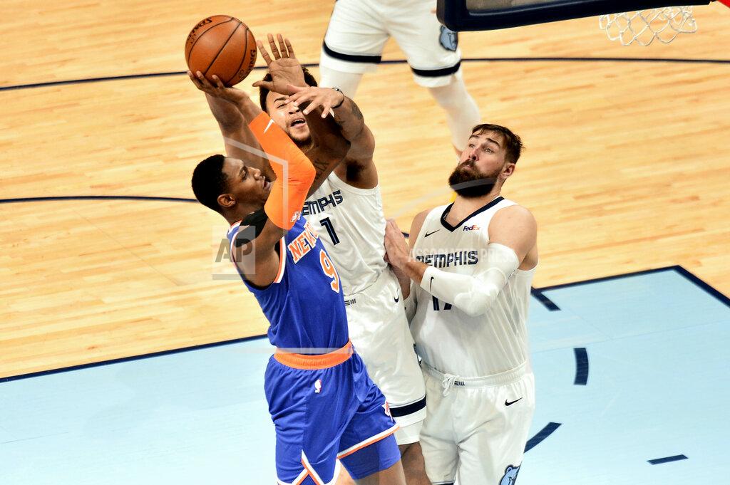 Brandon Dill New York Knicks guard RJ Barrett (9) shoots against Memphis Grizzlies forward Kyle Anderson (1) and center Jonas Valanciunas in the second half of an NBA basketball game Monday, May 3, 2021, in Memphis, Tenn. (AP Photo/Brandon Dill)