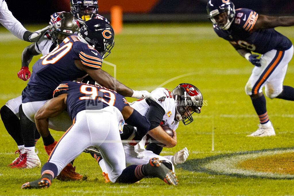 Charles Rex Arbogast Tampa Bay Buccaneers quarterback Tom Brady (12) is sacked by Chicago Bears outside linebacker Barkevious Mingo (50) and linebacker James Vaughters (93) during the second half of an NFL football game in Chicago, Thursday, Oct. 8, 2020. (AP Photo/Charles Rex Arbogast)