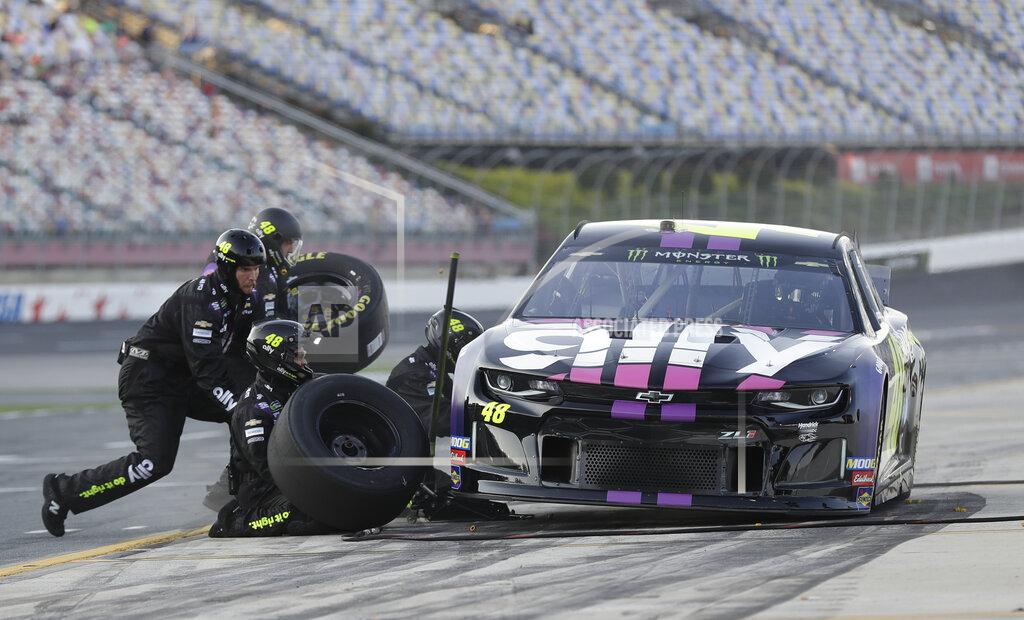 Chuck Burton Crew members perform a pit stop on driver Jimmie Johnson's car during qualifying for Saturday's NASCAR All-Star Cup series auto race at Charlotte Motor Speedway in Concord, N.C., Friday, May 17, 2019. (AP Photo/Chuck Burton)