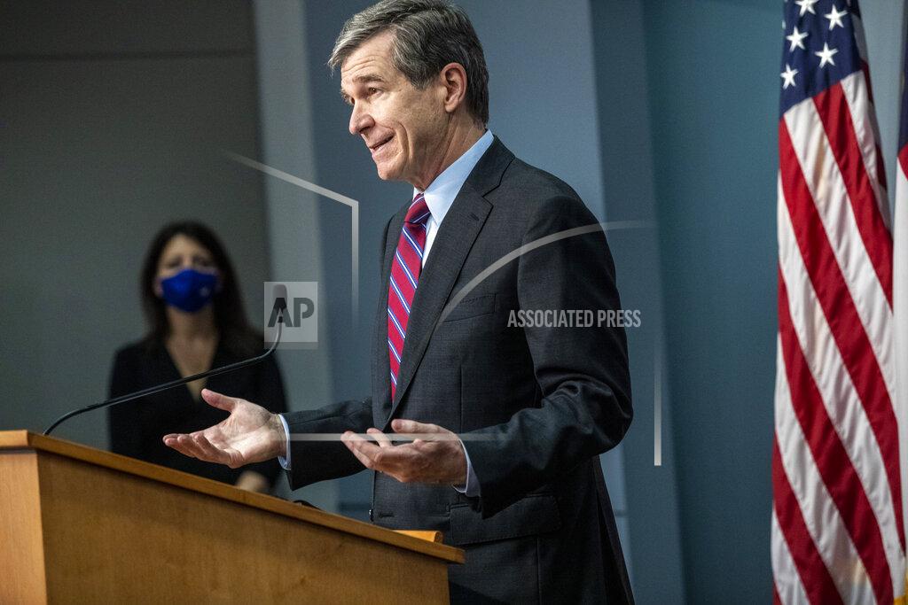 Travis Long Gov. Roy Cooper speaks during a briefing on North Carolina's coronavirus pandemic response Wednesday, Jan. 27, 2021 at the NC Emergency Operations Center in Raleigh.(Travis Long/The News & Observer via AP)