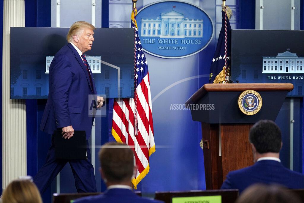 Evan Vucci President Donald Trump arrives for a news conference in the James Brady Press Briefing Room at the White House, Friday, Sept. 4, 2020, in Washington. (AP Photo/Evan Vucci)