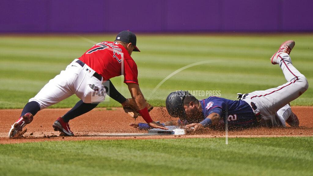 Tony Dejak Minnesota Twins' Luis Arraez, right, tries to steal to second base as Cleveland Indians' Cesar Hernandez, left, makes the tag in the first inning of a baseball game, Saturday, May 22, 2021, in Cleveland. (AP Photo/Tony Dejak)