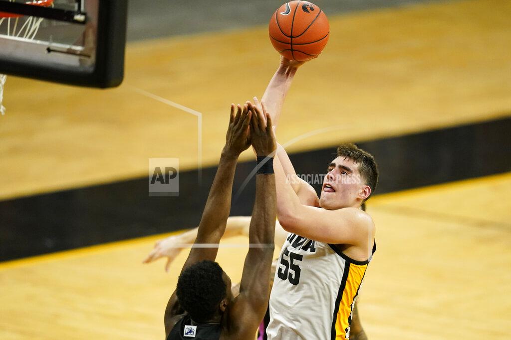 Charlie Neibergall Iowa center Luka Garza (55) shoots over Penn State forward Abdou Tsimbila during the second half of an NCAA college basketball game, Sunday, Feb. 21, 2021, in Iowa City, Iowa. Iowa won 74-68. (AP Photo/Charlie Neibergall)
