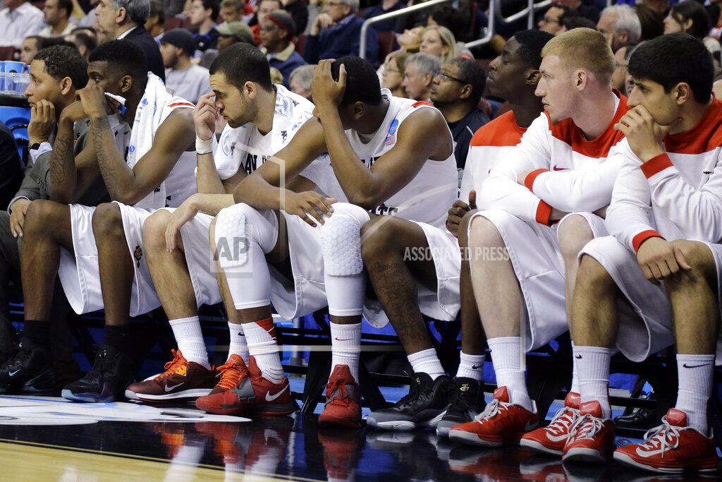 Matt Slocum FILE - In this March 24, 2013, file photo, San Diego State players watch from the bench in the final minutes of a third-round game against Florida Gulf Coast in the NCAA college basketball tournament in Philadelphia. Florida Gulf Coast won 81-71. The high-flying FGSU Eagles and their showstopping offense earned their place in NCAA Tournament lore when, as a No. 15 seed in the South Region, they upset Georgetown and San Diego State in Philadelphia to reach the 2013 Sweet 16. (AP Photo/Matt Slocum, File)