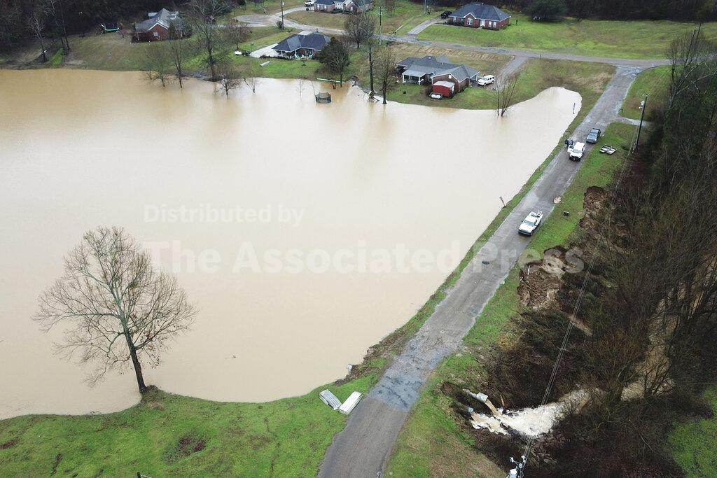 FILE - In this Feb. 11, 2020, file, aerial drone photo provided by the Mississippi Emergency Management Agency shows a potential dam/levee failure in the Springridge Place subdivision in Yazoo County, Miss. Heavy rains and recent flooding across the Southeastern U.S. have highlighted a potential public safety concern for some dams. An Associated Press review has identified hundreds of high hazard dams in the South that lack formal emergency action plans. (David Battaly/Mississippi Emergency Management Agency via AP, File)