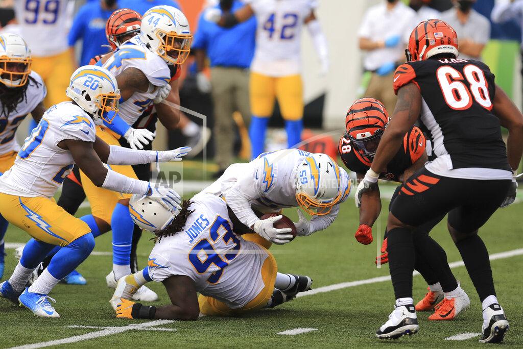 Aaron Doster Los Angeles Chargers outside linebacker Nick Vigil (59) recovers a fumble by Cincinnati Bengals' Joe Mixon (28) during the second half of an NFL football game, Sunday, Sept. 13, 2020, in Cincinnati. (AP Photo/Aaron Doster)