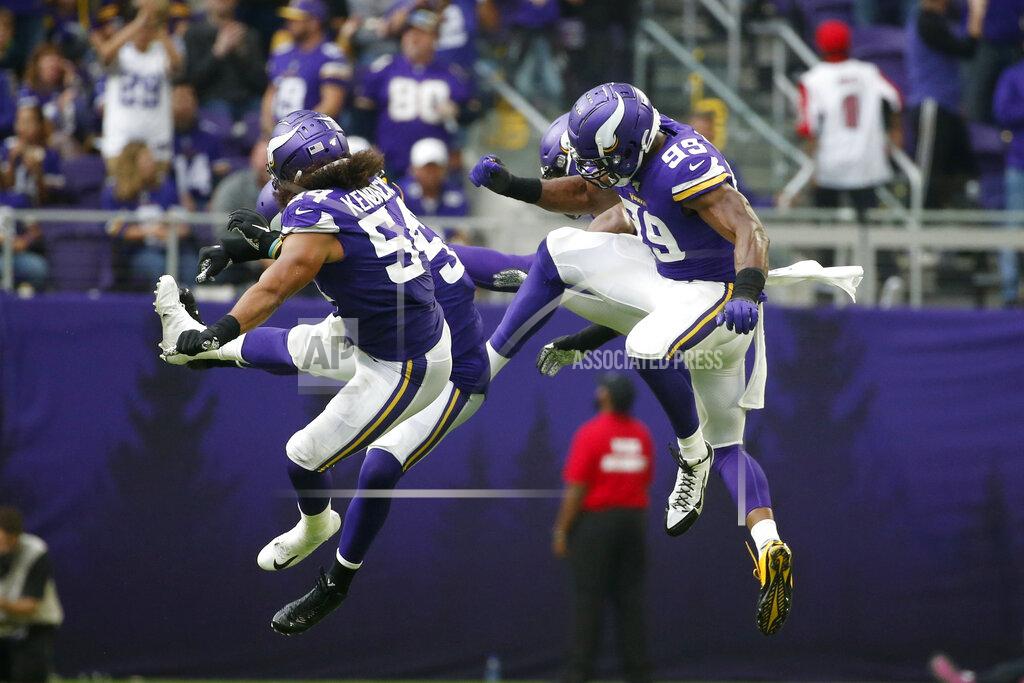 Bruce Kluckhohn Minnesota Vikings defensive end Danielle Hunter, right, and Eric Kendricks (54) celebrate with teammates during the first half of an NFL football game against the Atlanta Falcons, Sunday, Sept. 8, 2019, in Minneapolis. (AP Photo/Bruce Kluckhohn)