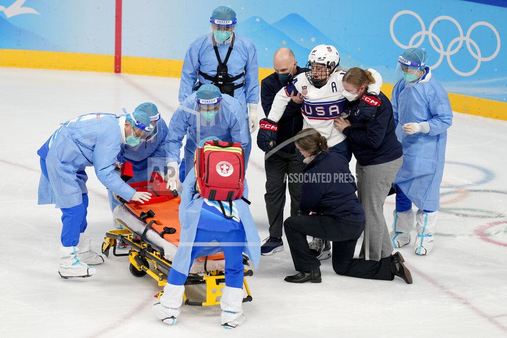 Petr David Josek United States' Brianna Decker is helped off the ice after being injured during a preliminary round women's hockey game against Finland at the 2022 Winter Olympics, Thursday, Feb. 3, 2022, in Beijing. (AP Photo/Petr David Josek)