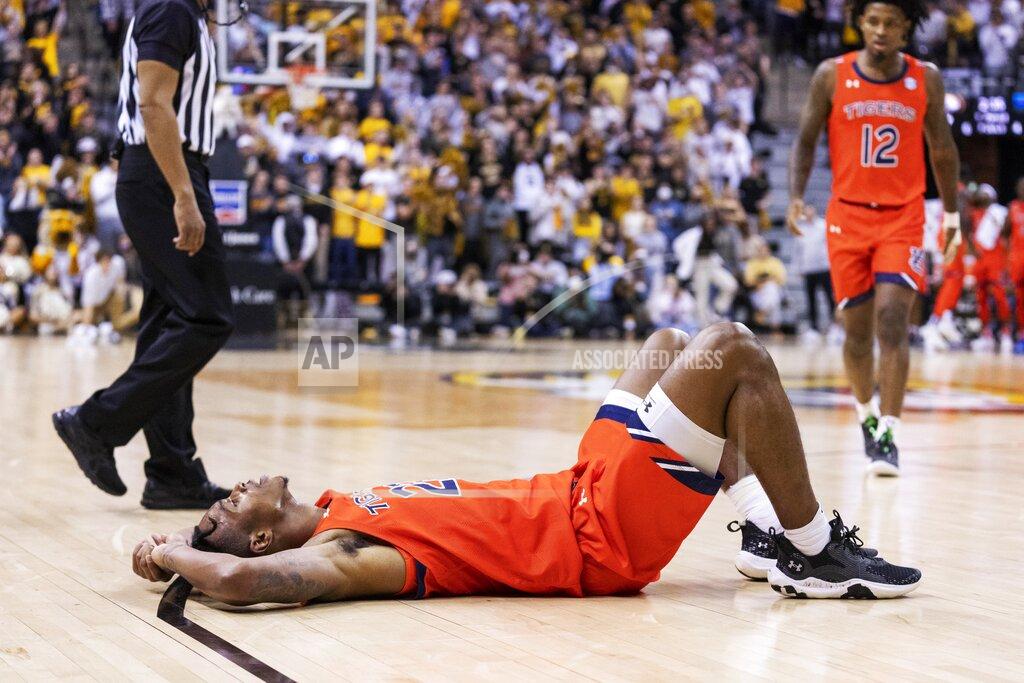 L.g. Patterson Auburn's Allen Flanigan lays on the court after he was fouled during the first half of an NCAA college basketball game against Missouri Tuesday, Jan. 25, 2022, in Columbia, Mo. (AP Photo/L.G. Patterson)
