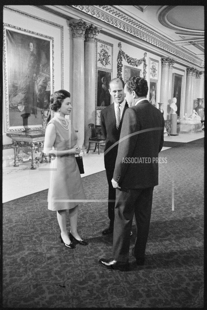 Uncredited In this undated image provided by The Richard Nixon Library & Museum, Queen Elizabeth II and her husband Prince Philip talk with U.S. President Richard Nixon at Buckingham Palace in London. (The Richard Nixon Library & Museum via AP)