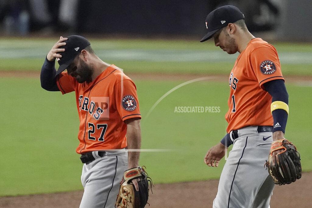 Jae C. Hong Houston Astros second baseman Jose Altuve (27) and Carlos Correa react after Tampa Bay Rays' Mike Zunino's home run during the second inning in Game 7 of a baseball American League Championship Series, Saturday, Oct. 17, 2020, in San Diego. (AP Photo/Jae C. Hong)