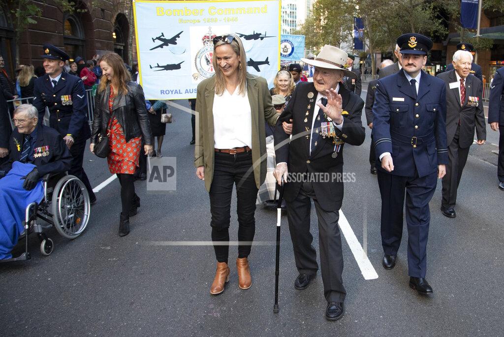 Mark Baker Veterans march during the Anzac Day parade in Sydney, Australia, Sunday, April 25, 2021. Australians and New Zealanders paid tribute to their war dead Sunday as both nations prepared to withdraw from their longest war in Afghanistan. (AP Photo/Mark Baker)
