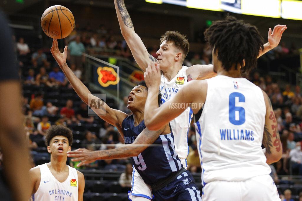 Jeff Swinger Memphis Grizzlies guard Ronaldo Segu (9) shoots against Oklahoma City Thunder guard Vit Krejci and forward Jaylin Williams (6) during the first half of an NBA summer league basketball game Wednesday, July 6, 2022, in Salt Lake City. (AP Photo/Jeff Swinger)