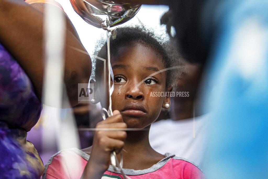 Jose F. Moreno A girl cries during a balloon release vigil, Friday, June 10, 2022, for Alexis Quinn, who was killed in the Philadelphia South Street mass shooting last weekend. (Jose F. Moreno/The Philadelphia Inquirer via AP)