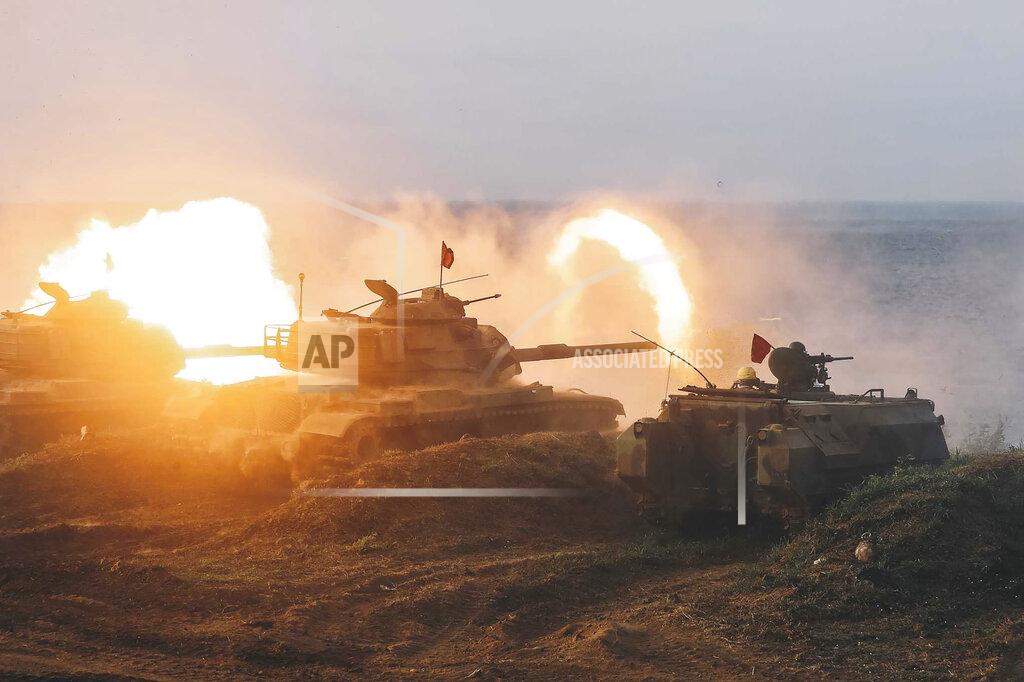 Uncredited In this photo released by the Taiwan Military News Agency, Taiwan armored units conducts a live firing drill to deter a coastal landing force during the Han Guang exercise held on the island of Penghu county, Taiwan, Wednesday, Sept. 15, 2021. Taiwan's annual five-day Han Guang military exercise is designed to prepare the island's forces for an attack by China, which claims Taiwan as part of its own territory. (Military News Agency via AP)