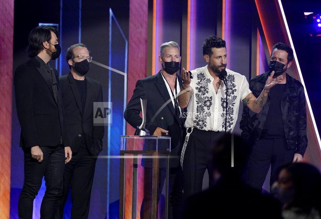 Mark Humphrey Matthew Ramsey, second from right, and members of Old Dominion, accept the award for group of the year at the 56th annual Academy of Country Music Awards on Sunday, April 18, 2021, at the Grand Ole Opry in Nashville, Tenn. (AP Photo/Mark Humphrey)