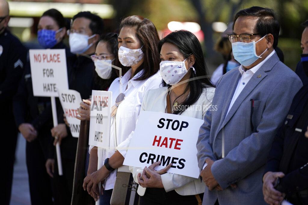 FILE - In this Monday, March 22, 2021 file photo, Demonstrators holds signs during a press conference calling to a halt on violence against Asian Americans in Los Angeles. Donations and contribution pledges to Asian American and Pacific Islander groups have spiked since the March 16 shooting in Atlanta that killed eight people, including six women of Asian descent. (AP Photo/Marcio Jose Sanchez, File)