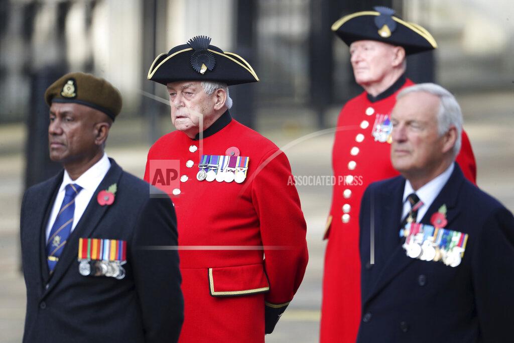 Chris Jackson Veterans stand, ahead of the start of the Remembrance Sunday service at the Cenotaph, in Whitehall, London, Sunday Nov. 8, 2020. (Chris Jackson/Pool Photo via AP)