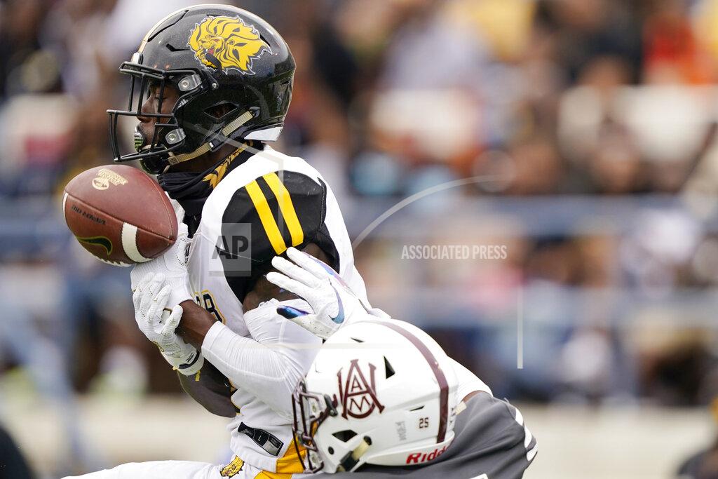 Rogelio V. Solis Alabama A&M cornerback Ja'Marian Green, below, knocks the pass away from Arkansas-Pine Bluff wide receiver Josh Wilkes (3) during the second half of the Southwestern Athletic Conference championship NCAA college football game Saturday, May 1, 2021, in Jackson, Miss. (AP Photo/Rogelio V. Solis)
