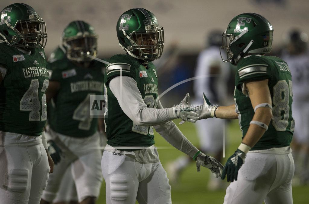 Jake Crandall Eastern Michigan defensive back Blake Bogan (23) high fives wide receiver Mathew Sexton (87) after Sexton blocked a punt during the Camellia Bowl NCAA college football game in Montgomery, Ala., on Saturday, Dec. 15, 2018. (Jake Crandall/The Montgomery Advertiser via AP)