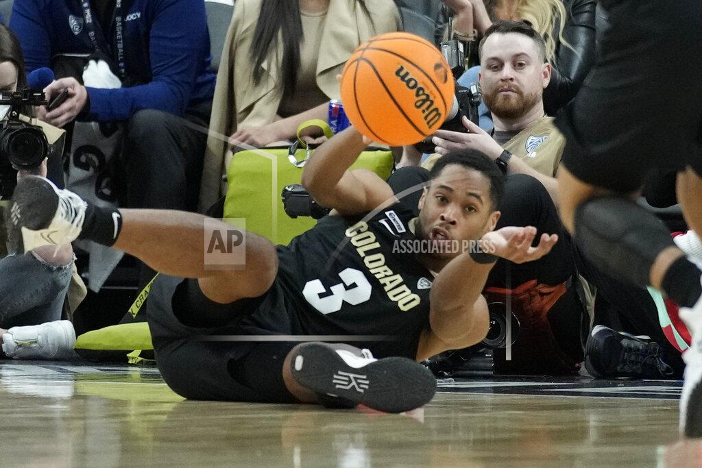 John Locher Colorado's Keeshawn Barthelemy (3) passes from the floor against Arizona during the second half of an NCAA college basketball game in the semifinal round of the Pac-12 tournament Friday, March 11, 2022, in Las Vegas. (AP Photo/John Locher)