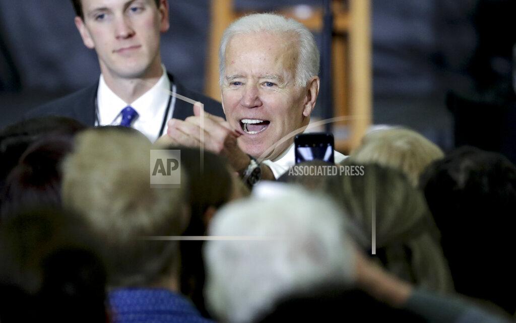 FILE - In this Oct. 30, 2018, file photo, presumptive Democratic presidential nominee, former Democratic Vice President Joe Biden greets supporters during a rally with Wisconsin Democrats in Madison Wis. While Democrats are still planning to meet in person in Milwaukee in August, Wisconsin's state convention was scaled back from a two-day event to a two-hour virtual meeting. But the goal of focusing on beating Trump remains the same. (Steve Apps/Wisconsin State Journal via AP, File)